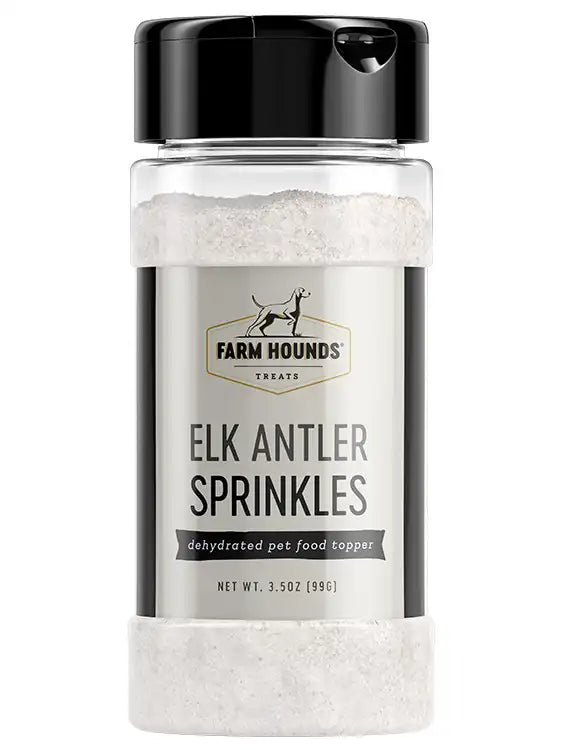 a clear bottle of white food topper labeled elk antler sprinkles