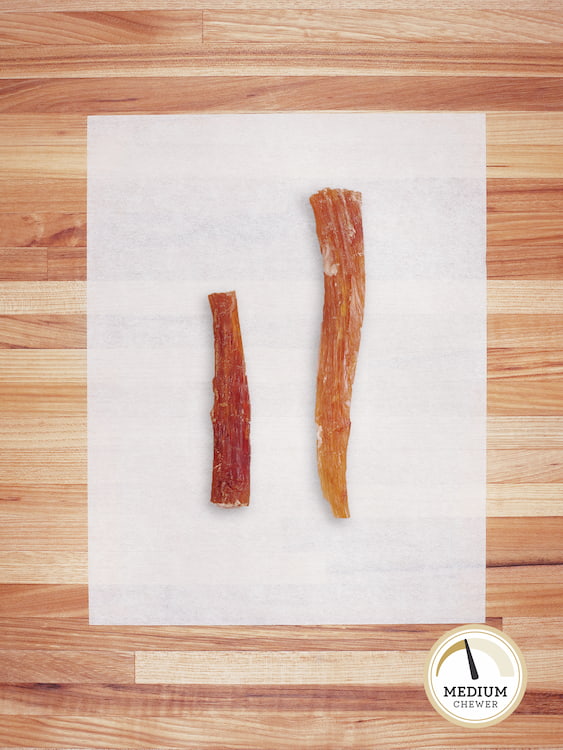 small and large beef backstrap on a butcher block countertop