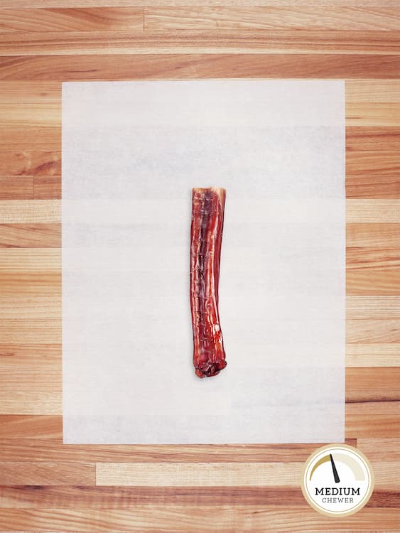 one short bully stick on butcher block countertop