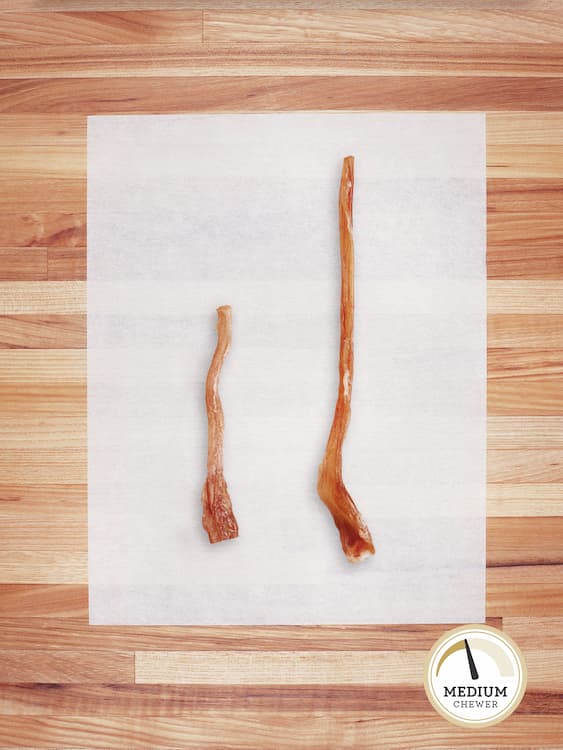 small and large beef hock tails on a butcher block countertop