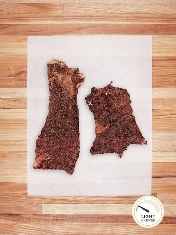 two pieces of beef tripe on a butcher block countertop