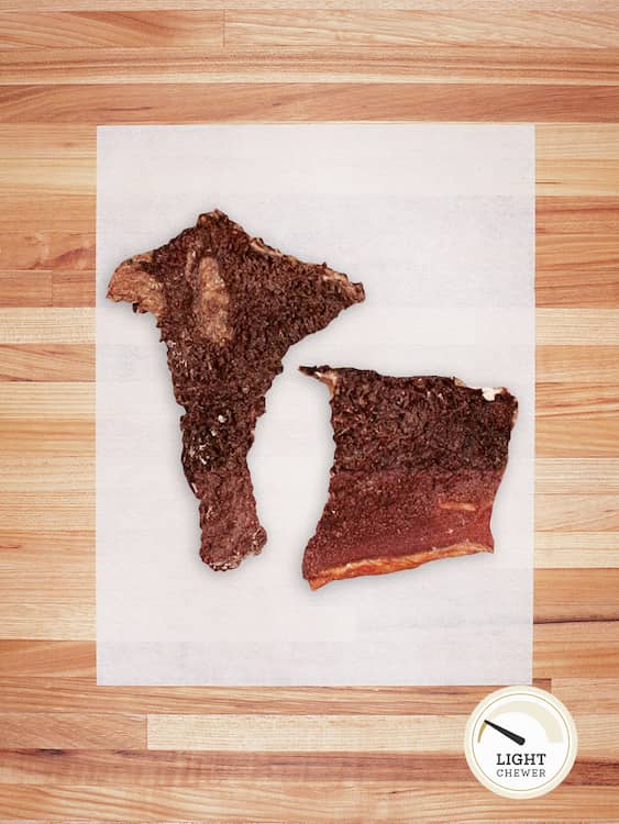 two pieces of beef tripe on a butcher block countertop