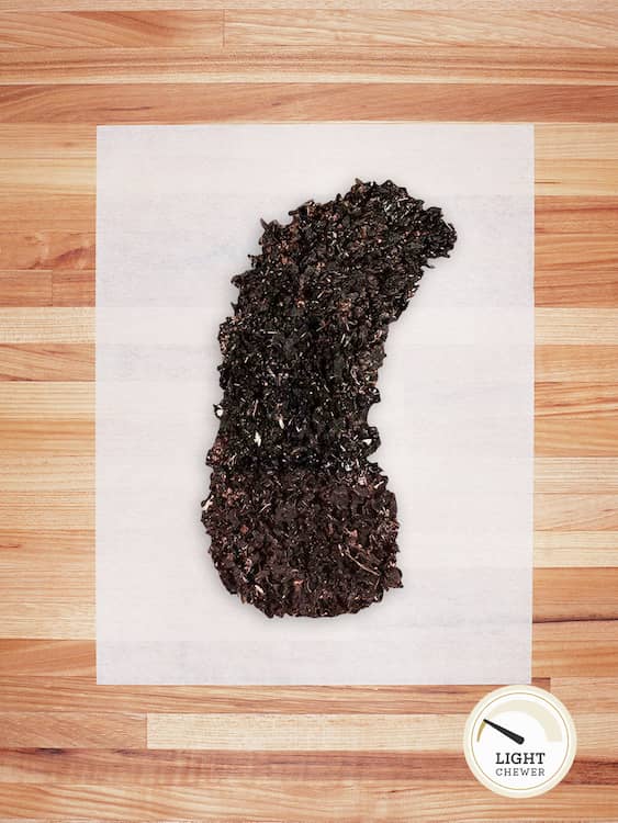 black beef tripe on a butcher block countertop