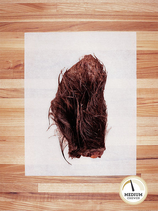 brown bison ear on a butcher block countertop