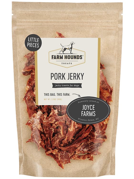 pork jerky little pieces in a sealed kraft paper pouch bag with a clear front and a farm partner sticker