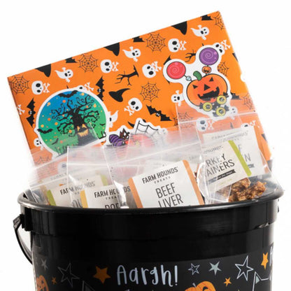 variety sample bags in a trick-or-treat basket with halloween decorations