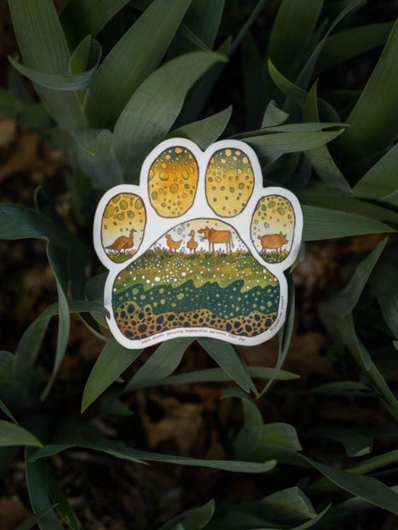 illustrated paw print sticker with earth and sky and cute farm animals