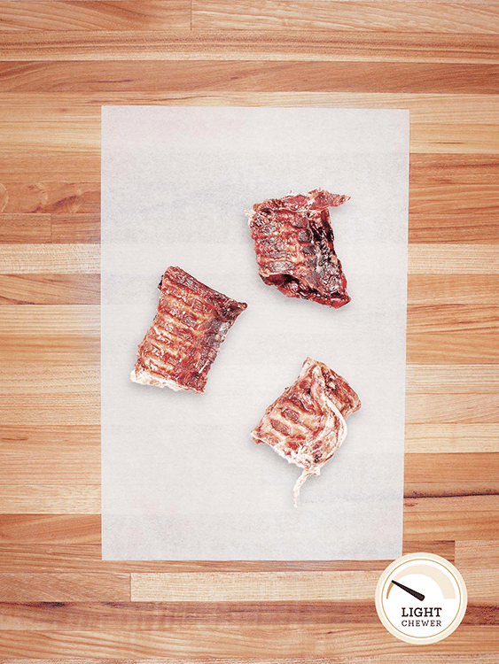 beef trachea scrap on a butcher block countertop